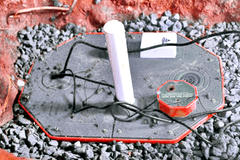 Sump pump installed in home with rocks
