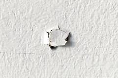 Nail pop in drywall.