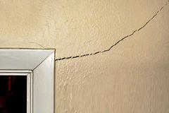 Interior vertical foundation crack on the doorway wall.