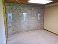 Wall anchors were installed on the interior cinderblock basement wall.