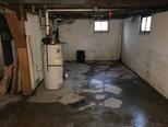 Wet interior basement floor.