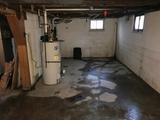 Wet interior basement floor.