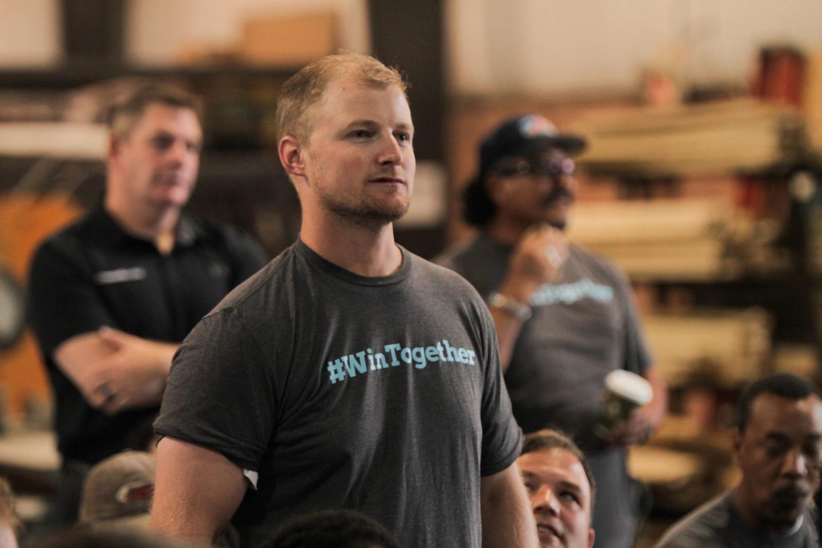Staff with #wintogether shirt.