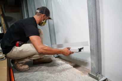 Crew installing BasementGutter