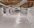 Encapsulated crawl space with insulated pipes.