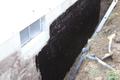 Tar Coating on the exterior foundation wall.