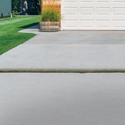 Uneven driveway with garage.