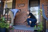 Inspector showing homeowner their foundation.