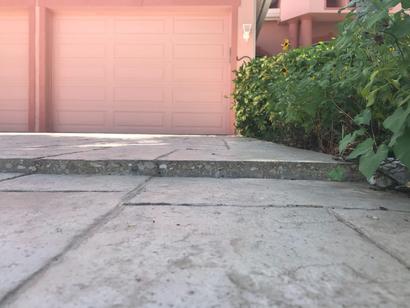 Close-up of an uneven driveway.