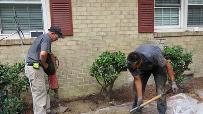Crew digging and grading front yard.