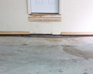 Cracked and uneven garage slab.