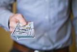 Man holding money in his hand.