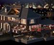 Cutaway view of a large house with a detailed interior, showing multiple floors, rooms, and a treehouse outside at night.