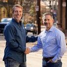 Aquaguard's Tom and Joe are shaking hands.
