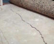 Interior cracked concrete slab.