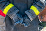 A firefighter's hand while in uniform.