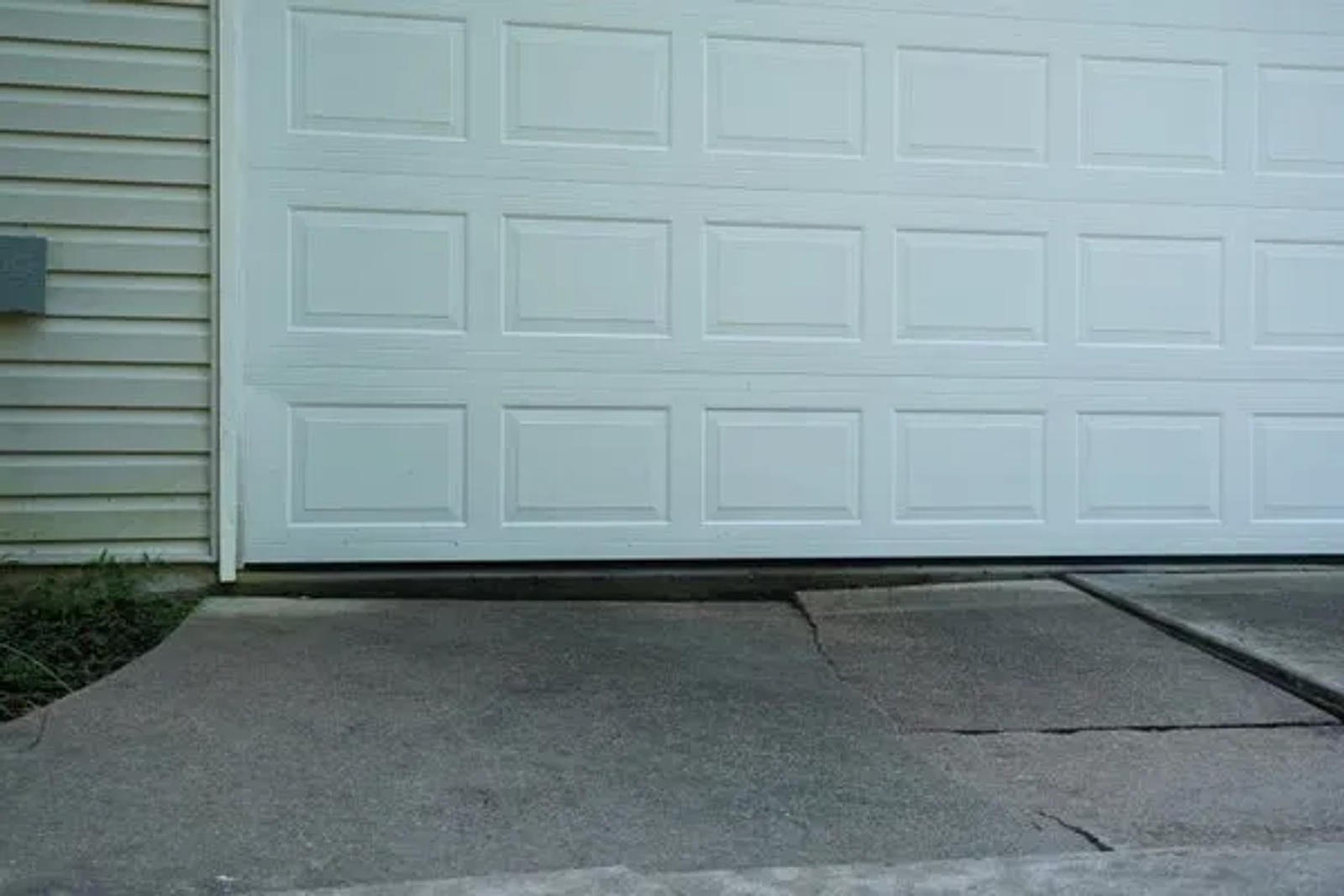 Uneven driveway with garage