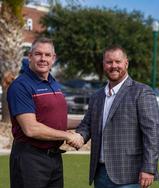 Eco-Soil Crew and Matt Malone merge event handshake.