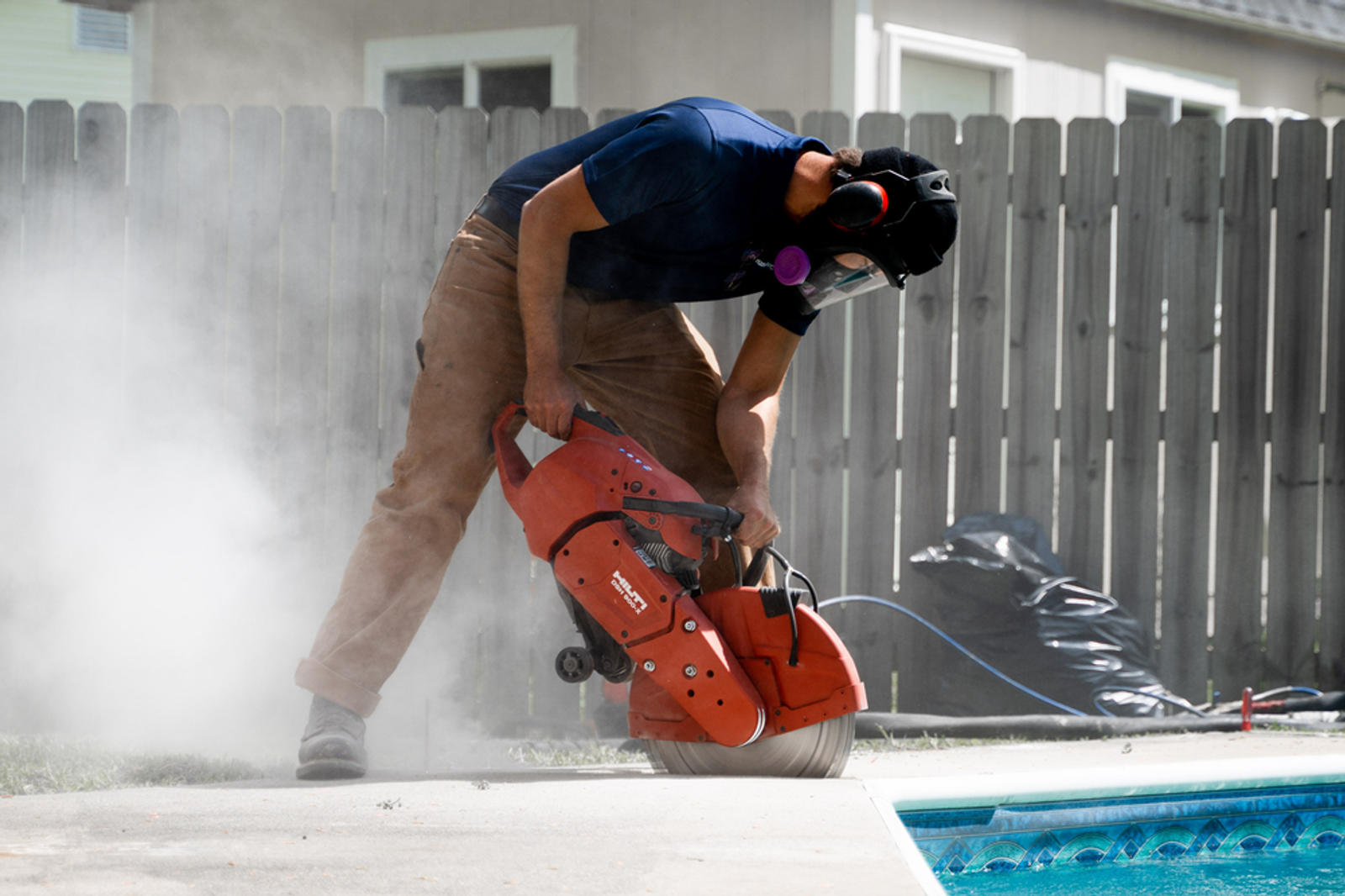 Groundworks worker fixing pool deck