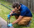 crew member lifting concrete with polyurethane injections