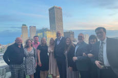 Groundworks staff stands against cityscape background