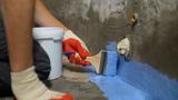 applying "waterproof" paint to basement wall and floor