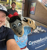 Groundworks staff pose with mascot