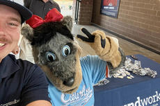 Groundworks staff pose with mascot
