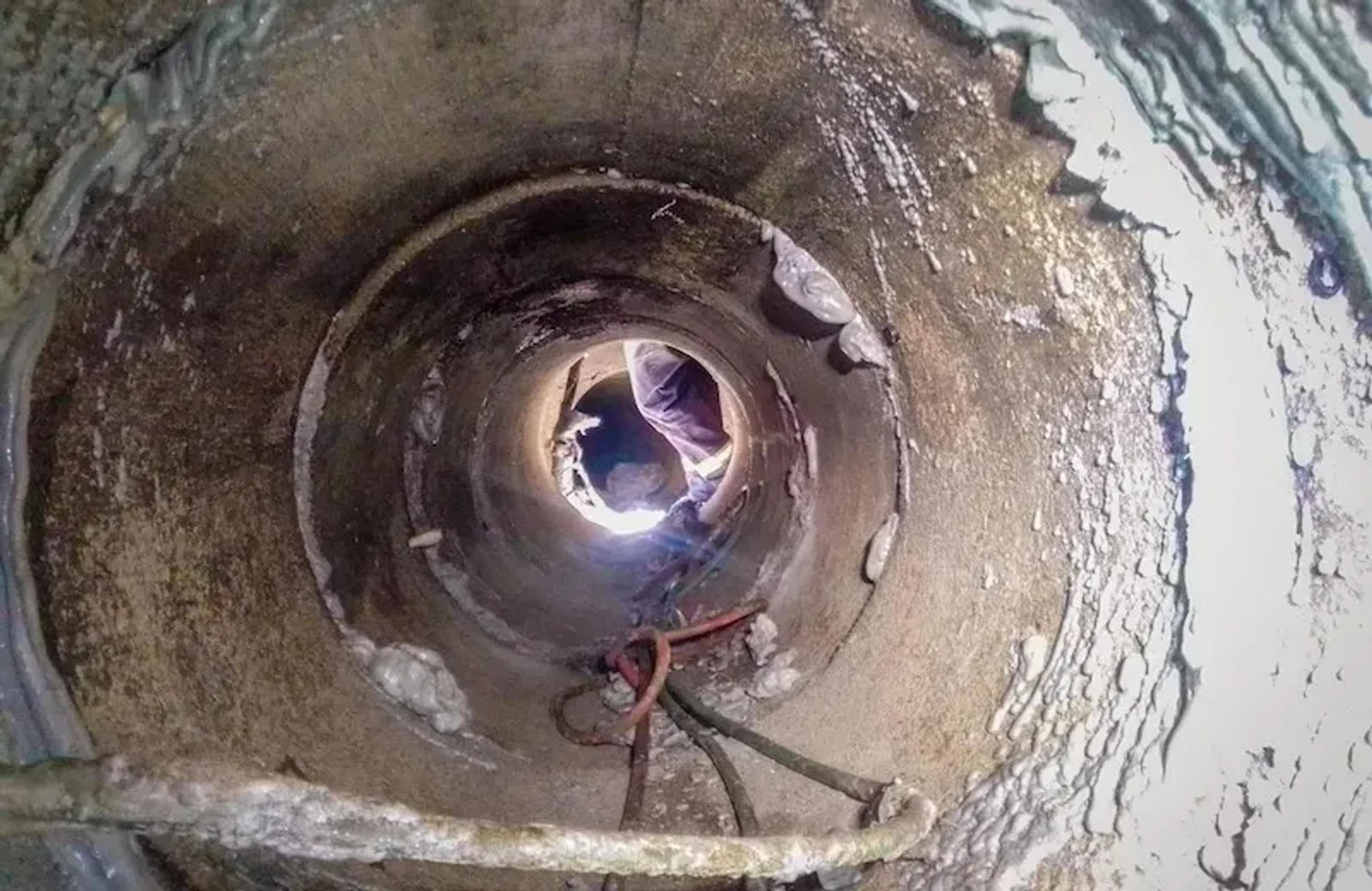 View from inside a pipe, gazing toward the opening, reminiscent of a Rancho Cucamonga case study, with a rope visible.