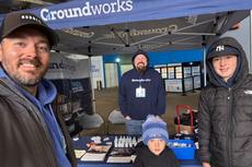 Groundworks employees huddling under a tent at the NJSIAA Football State Championships