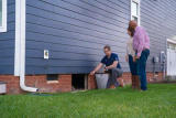 Groundworks inspector with homeowners