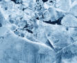 Close-up of abstract ice patterns with various shades of blue and white, forming geometric shapes and textures.