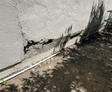 Bulging wall on side of home.