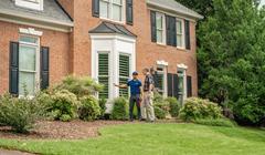 homeowner and inspector standing outside home