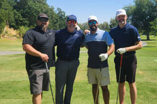 Four Groundworks team members pose for a photo at the Bay Area Regional Golf Tournament