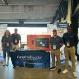 Groundworks team members at a booth at a Memphis Redbirds game.