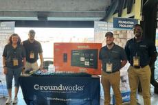 Groundworks team members at a booth at a Memphis Redbirds game.