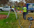 image of workers injected polyurethane around a stormwater pipe for storm water pipe joint sealing