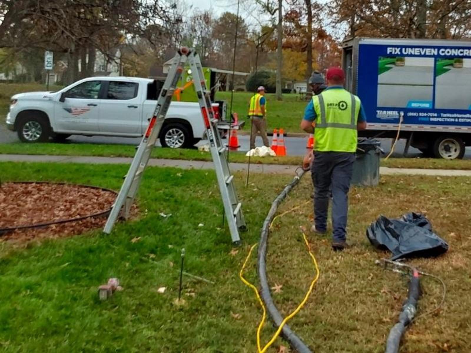 image of workers injected polyurethane around a stormwater pipe for storm water pipe joint sealing