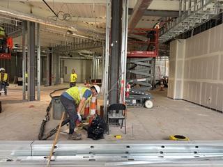 image of workers performing polyurethane injection underneath a column