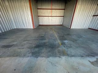 image of stoarge bay needing concrete leveling for Storage Bay Slab Rehabilitation at Charlotte-Monroe Executive Airport