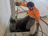crew member installing push piers