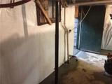fieldstone foundation basement waterproofed with drainage and wall vapor barrier