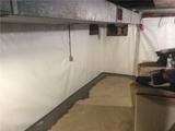 fieldstone foundation basement walls covered with a vapor barrier