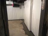 fieldstone foundation basement waterproofing with interior drainage and a vapor barrier