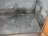 evidence of water leaks and damage in a basement