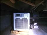 dehumidifier installed in an encapsulated crawl space