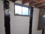 carbon fiber straps installed on a basement wall