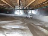 crawl space repair with a vapor barrier, insulation panels, and a sump pump