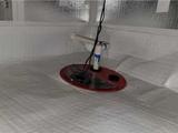 crawl space encapsulated with a vapor barrier, insulation panels, and a sump pump